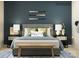 Inviting bedroom features a cozy bed with decorative pillows and stylish bedside tables at 1616 Swallow Tail Dr, Cramerton, NC 28012
