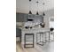 Stylish kitchen showcasing a central island with bar stools and modern stainless steel appliances at 2230 Endeavor Run, Charlotte, NC 28269
