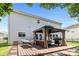 Exterior backyard view showcasing a wooden deck with a gazebo and furniture, offering an inviting outdoor space at 10418 Cullen Ct, Charlotte, NC 28278