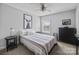Comfortable bedroom with framed animal art and a ceiling fan with carpet at 10418 Cullen Ct, Charlotte, NC 28278