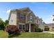 Beautiful two-story home with stone accents, well-maintained lawn, and blue skies at 10418 Cullen Ct, Charlotte, NC 28278