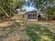 Backyard featuring a screened in porch, wood deck and a spacious yard with mature trees at 1634 Dawson Ct, Rock Hill, SC 29730