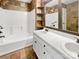 Bathroom features a double sink vanity, bathtub, and decorative backsplash for a functional and stylish design at 1634 Dawson Ct, Rock Hill, SC 29730