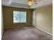 Spacious main bedroom with a window and neutral paint at 2113 Ballingarry Dr, Statesville, NC 28625