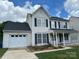 Charming two-story home with black shutters and a well-maintained lawn at 2113 Ballingarry Dr, Statesville, NC 28625