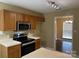 Functional kitchen featuring wood cabinets, stainless steel appliances, and ample counter space at 2113 Ballingarry Dr, Statesville, NC 28625