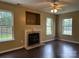 Inviting living room with a fireplace and large windows for natural light at 2113 Ballingarry Dr, Statesville, NC 28625