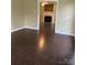 Inviting living room featuring a fireplace and wood-look flooring at 2113 Ballingarry Dr, Statesville, NC 28625