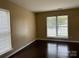 Inviting living room featuring a with large windows and wood-look flooring at 2113 Ballingarry Dr, Statesville, NC 28625