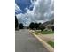 Street view of a charming residential area, featuring well-maintained houses and tree-lined streets at 2113 Ballingarry Dr, Statesville, NC 28625