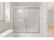 Bathroom with toilet and glass shower/tub combination at 2508 Wood Star Ct, Matthews, NC 28105