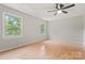 Bedroom features two windows, ceiling fan and wood flooring at 2508 Wood Star Ct, Matthews, NC 28105
