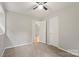Bedroom features neutral carpet and an open door into the hallway at 2508 Wood Star Ct, Matthews, NC 28105