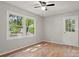 Bedroom with neutral walls and trim, featuring large windows providing bright natural light at 2508 Wood Star Ct, Matthews, NC 28105