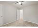 Bedroom features neutral carpet and an open door into the hallway at 2508 Wood Star Ct, Matthews, NC 28105