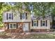 Charming two-story home with a brick facade and black shutters at 2508 Wood Star Ct, Matthews, NC 28105