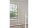 Hallway view with white trim, gray walls and view of a car outside at 2508 Wood Star Ct, Matthews, NC 28105