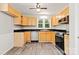 Kitchen featuring wood cabinets, black countertops and stainless appliances at 2508 Wood Star Ct, Matthews, NC 28105