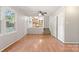 Inviting living space with wood floors, natural light, and open access to the kitchen at 2508 Wood Star Ct, Matthews, NC 28105