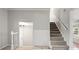 Carpeted staircase leads to the upper level of the home at 2508 Wood Star Ct, Matthews, NC 28105