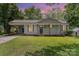 Charming home with a covered front porch, inviting entry, and well-manicured front lawn at 3015 Lasalle St, Charlotte, NC 28216