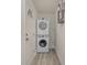 Laundry room area features stacked white washer and dryer near the back door at 3015 Lasalle St, Charlotte, NC 28216