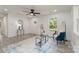 Bright living room featuring recessed lighting, gray flooring, and a modern ceiling fan at 3015 Lasalle St, Charlotte, NC 28216