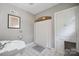 Bathroom featuring tile floor, shower, and built in storage with vintage sink at 630 4Th Nw Ave, Hickory, NC 28601