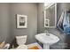 Well-maintained half bathroom with pedestal sink and updated fixtures at 630 4Th Nw Ave, Hickory, NC 28601
