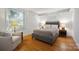 Cozy bedroom featuring natural light, hardwood flooring, and stylish furnishings at 630 4Th Nw Ave, Hickory, NC 28601