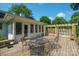 A spacious wooden deck with an outdoor table and chairs, perfect for entertaining and relaxing outdoors at 630 4Th Nw Ave, Hickory, NC 28601
