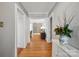 Hallway view with hardwood floors leading to a room with built in shelves at 630 4Th Nw Ave, Hickory, NC 28601