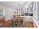 Eat-in kitchen featuring white cabinets and a sunny dining nook at 630 4Th Nw Ave, Hickory, NC 28601