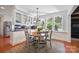 Eat-in kitchen featuring white cabinets and a sunny dining nook at 630 4Th Nw Ave, Hickory, NC 28601