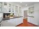 Bright kitchen with custom cabinets, open shelving, and stainless steel hardware at 630 4Th Nw Ave, Hickory, NC 28601