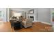 Inviting living room with elegant fireplace, hardwood floors, and seating area with natural light at 630 4Th Nw Ave, Hickory, NC 28601