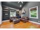 Cozy living room featuring built-in shelving, hardwood floors, and comfortable seating at 630 4Th Nw Ave, Hickory, NC 28601