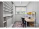 Bright home office featuring built in shelves, a desk, and a large window at 630 4Th Nw Ave, Hickory, NC 28601