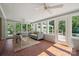 Inviting sunroom with tiled floor, a ceiling fan, and expansive views of the backyard at 630 4Th Nw Ave, Hickory, NC 28601