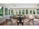 Charming sunroom with lots of windows allowing for natural light and comfortable seating at 630 4Th Nw Ave, Hickory, NC 28601