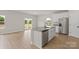 Kitchen featuring a central island, stainless appliances, and easy access to the backyard at 7007 Jerimoth Dr, Charlotte, NC 28215
