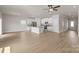 Bright, open-concept living space featuring hardwood floors and a modern kitchen at 7007 Jerimoth Dr, Charlotte, NC 28215