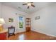 Well-lit bedroom features hardwood floors, a ceiling fan and a large window with outdoor views at 7015 Gracefield Ln, Fort Mill, SC 29707