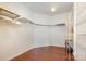 Spacious walk-in closet featuring hardwood floors, wire shelving and ample storage space at 7015 Gracefield Ln, Fort Mill, SC 29707