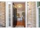 Welcoming foyer with hardwood floors and ample natural light, offering a glimpse into the home's elegant interior at 7015 Gracefield Ln, Fort Mill, SC 29707
