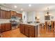 Bright, updated kitchen with granite countertops, stainless steel appliances, and an island with an eat-in bar at 7015 Gracefield Ln, Fort Mill, SC 29707
