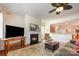 Inviting living room with a cozy fireplace, hardwood floors, and open layout, perfect for entertaining and relaxation at 7015 Gracefield Ln, Fort Mill, SC 29707