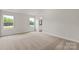 A sun-filled bedroom with neutral carpet at 7023 Jerimoth Dr, Charlotte, NC 28215
