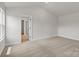A sun-filled bedroom with neutral carpet at 7023 Jerimoth Dr, Charlotte, NC 28215