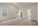 A spacious primary bedroom with carpet floors and windows, offering a comfortable retreat at 7319 Jerimoth Dr, Charlotte, NC 28215